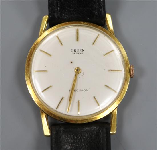 A gentlemans 18ct gold Gruen Precision manual wind wrist watch, on associated strap.